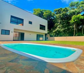 Casa no Bairro Itacorubí em Florianópolis com 4 Dormitórios (4 suítes) - CA00263V